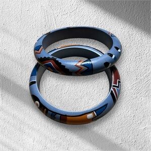 Two wooden handpainteded Southwest style pattern bracelets 8”